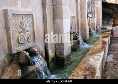 Traditional stone fountain structure located in the village of Meronas, on the island of Crete. Stock Photo