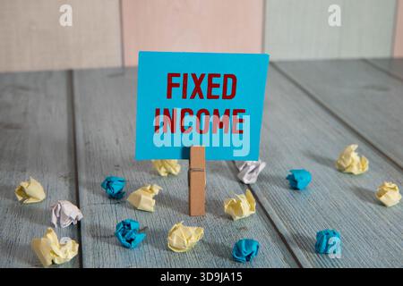 Fixed income symbol. Concept word Fixed Income on wooden blocks. Business and fixed income concept. Copy space Stock Photo