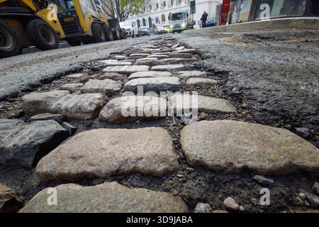 Bucharest, Romania. 2nd Dec, 2025: The old cobblestone is seen under the removed pavement under repair on Academiei Street. Stock Photo