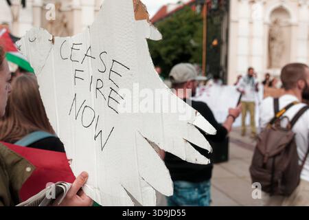 A protester holds a sign reading 