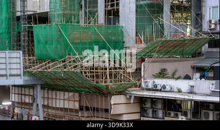 Bamboo scaffolding used for construction on building exteriors, Hong Kong, China. Stock Photo