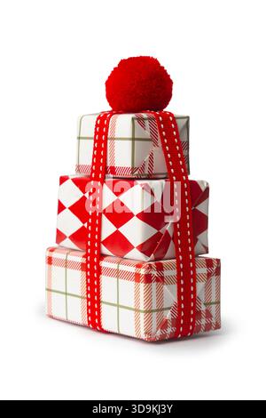 Stacked christmas gift boxes with red bow on white background Stock Photo