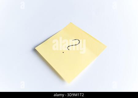 Yellow sticky note with question mark Stock Photo