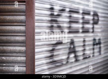 Urban Scene With 'Keep Calm' Written In Spray Paint On Some Shutters, With Shallow Depth Of Focus Stock Photo