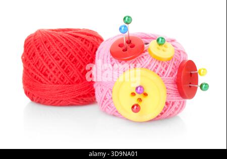 Balls of bright knitting yarn with buttons and pins isolated on white Stock Photo