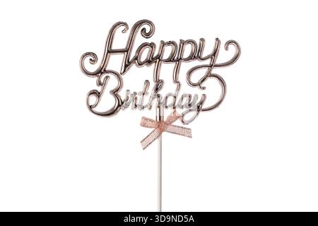 Birthday cake topper with glittery text and bow Happy Birthday isolated on white background Stock Photo