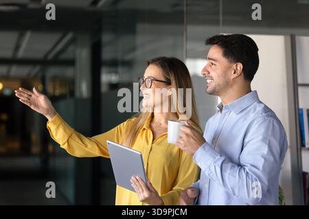 Positive young diverse business colleagues standing together Stock Photo