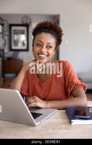 Happy young African American project manager working from home Stock Photo