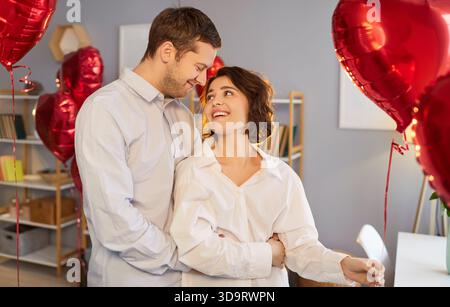 Married Couple With Heart Balloons On Valentine's Day Stock Photo