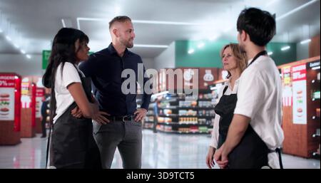 Diverse Retail Team Celebrates Success With Chef Business Owner Handshake. Stock Photo