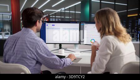 Business Analyst Man And Woman Using Inventory Management Software System Stock Photo