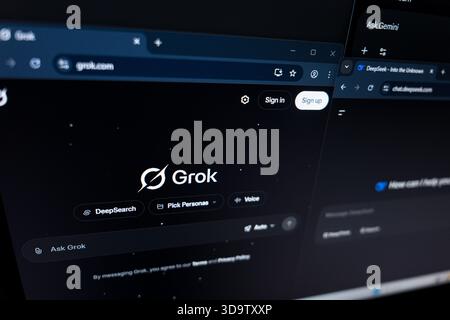 Grok AI website interfaces on computer screen Stock Photo