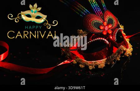 Banner with text HAPPY CARNIVAL and mask on dark background Stock Photo