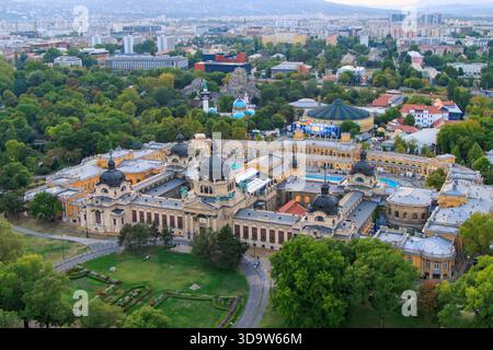 Budapest, Hungary. The Szechenyi Spa is one of Europe's largest spa complexes in the Budapest City Park. In the background, the Capital Circus and the Stock Photo