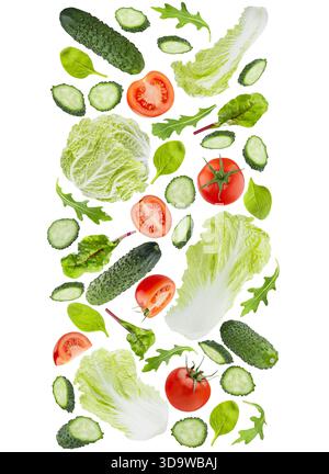 DNA spiral of fresh vegetables as healthy eating background. Salad ingredients - tomatoes, cucumbers, leafy greens, cabbage flying, isolated. For orga Stock Photo