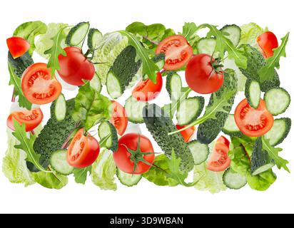 DNA spiral of fresh vegetables as healthy eating background. Salad ingredients - tomatoes, cucumbers, leafy greens, cabbage flying, isolated. For orga Stock Photo
