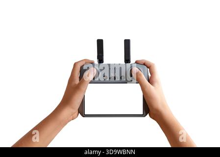 Hands holding a remote drone controller with empty screen, ideal for inserting custom UI, drone app mockups, or interface concepts Stock Photo