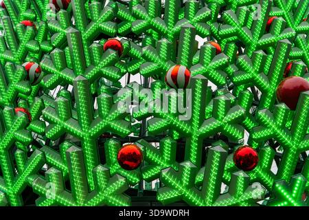 Melbourne, VIC, Australia. December 06, 2025. - A vibrant, contemporary holiday display showcasing glowing green snowflake-like geometric patterns alo Stock Photo