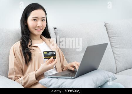 Portrait woman using smartphone for online shopping at home. stay home, technology, electronic commerce, internet, market place, final or summer or bi Stock Photo