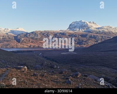 Snowy Slioch rising above Loch Maree, viewed from Beinn a’ Chearcaill in the Torridon mountains of the West Scottish Highlands. Stock Photo