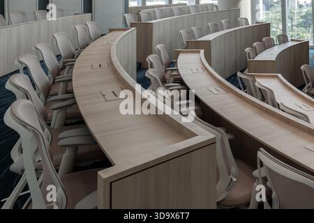 Bangkok,Thailand - 18 Oct, 2025 - Characterized by its distinctly modern, minimalist design and semi-circular, tiered seating, this auditorium provide Stock Photo
