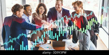 Business Team Celebrates Project Success With High Fives and Teamwork in Office Setting Stock Photo