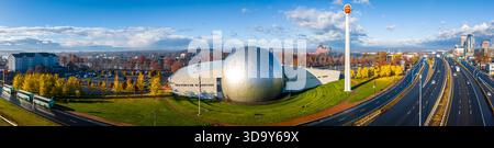 High-angle drone shot of the Naismith Memorial Basketball Hall of Fame with its iconic silver dome and giant basketball sculpture, perfect for sports Stock Photo