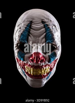 Scary clown halloween mask isolated on black background with clipping path Stock Photo