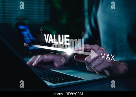 The concept of business value added. Businessman touching virtual progress bar with the word value for business growth. increase value, company value Stock Photo