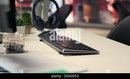 Office desktop setup includes monitors displaying terminal interfaces and AI systems. The self learning model showcases deep learning innovations and modern computing technologies. Stock Photo
