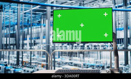 Industrial plant isolated screen display visualizing robotic arms performance and metrics from IoT sensors. Chroma key monitor displaying analytics for Industry 4.0 smart factory equipment, close up Stock Photo