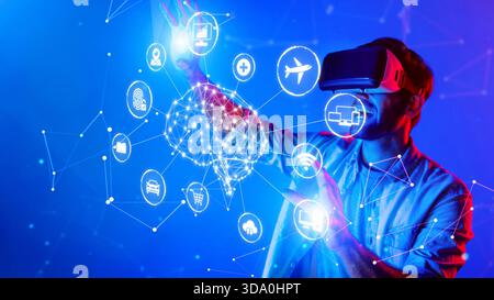 A young man in a virtual reality headset engages with a vivid digital environment, illustrating the potential of technology in innovative experiences Stock Photo