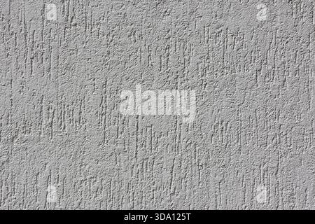 Rugged white concrete wall close-up abstract textured background Stock Photo