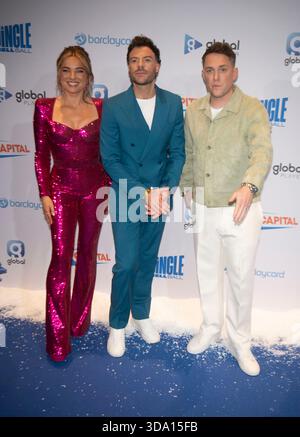 Sian Welby, Jordan North and Chris Stark   attends the  Capital's Jingle Bell Ball at The O2 Arena on December 06, 2025 in London, England. Stock Photo