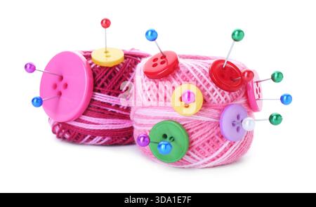 Balls of bright knitting yarn with buttons and pins isolated on white Stock Photo