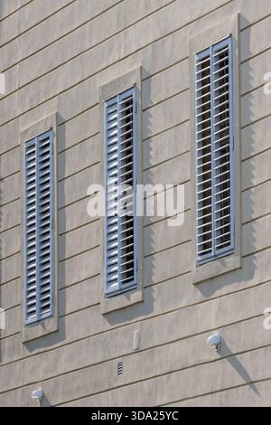 Closed wooden shutters on the exterior facade Stock Photo