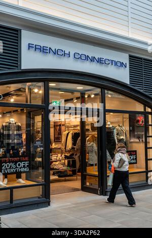 Customer entering French connection retail store in Gunwharf quays, Portsmouth Hampshire, UK Stock Photo