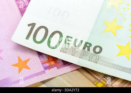 Currency notes featuring 100 euro bill and other denominations in close view Stock Photo