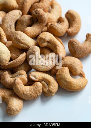 Roasted Cashew Nuts Close-Up on White Background Stock Photo