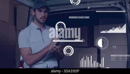Reviewing worker in short-sleeve shirt and cap checking tablet with stylus in van rear, boxes, HUD Stock Photo