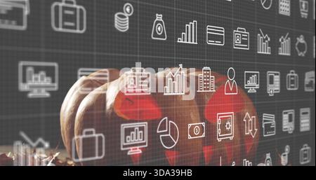 Displaying three small orange pumpkins resting on wooden tabletop with hay, digital finance icons Stock Photo