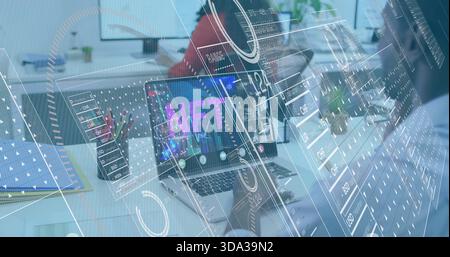 Displaying silver laptop showing NFT on office desk, showing AR overlays, team wearing smart shirts Stock Photo