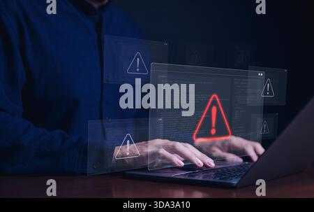 Cybersecurity alert concept. Person using laptop with multiple warning symbols displayed, indicating cyber security alert. importance of digital secur Stock Photo
