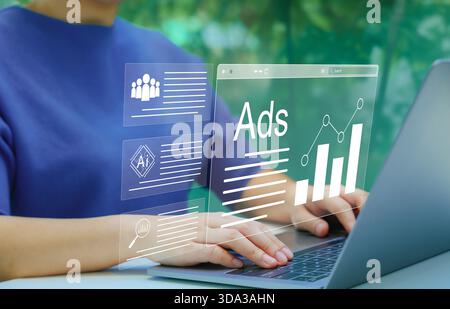 AI Analyzing Online Advertising Campaigns. Digital marketing concept. Person using laptop with virtual displays Ads and graphs, AI technology in digit Stock Photo
