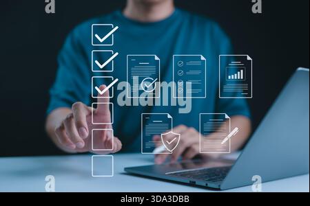 Digital form checklist, Online survey concept. Person interacts with digital form checklist on laptop with process of filling out online survey and co Stock Photo