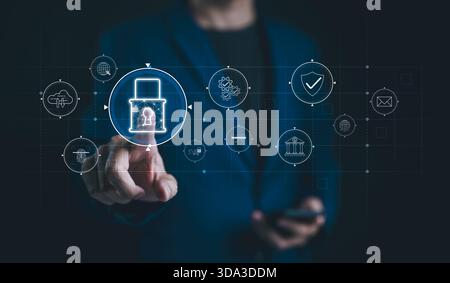 Cybersecurity management, Data protection concept. Businessman interacts with digital interface focusing on cyber security management and data protect Stock Photo