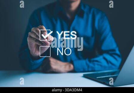 Decision-Making with Yes or No Choice Checkbox, A hand selecting "Yes" from a digital checkbox interface, symbolizing decision-making, approval, or ag Stock Photo