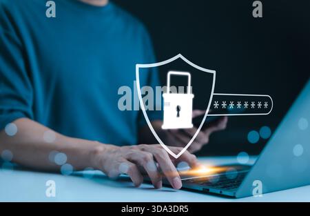 Cyber security concept. Lock icon and password input, Person using laptop with a digital shield icon representing cybersecurity, showcasing online sec Stock Photo