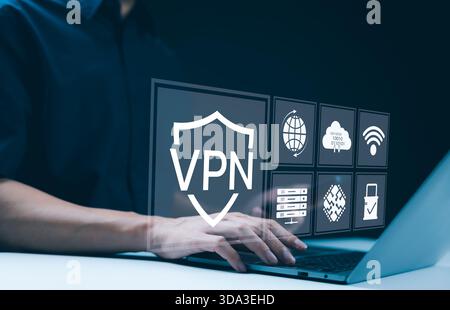 VPN Virtual Private network protocol concept, A person using laptop with interface displaying VPN technology and cybersecurity icons, representing sec Stock Photo