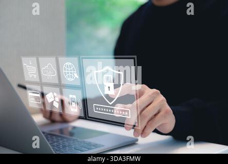 Cybersecurity and Data Protection Technology Concept. Man interacts with security icons, lock symbol, password protection, and global connectivity, Stock Photo